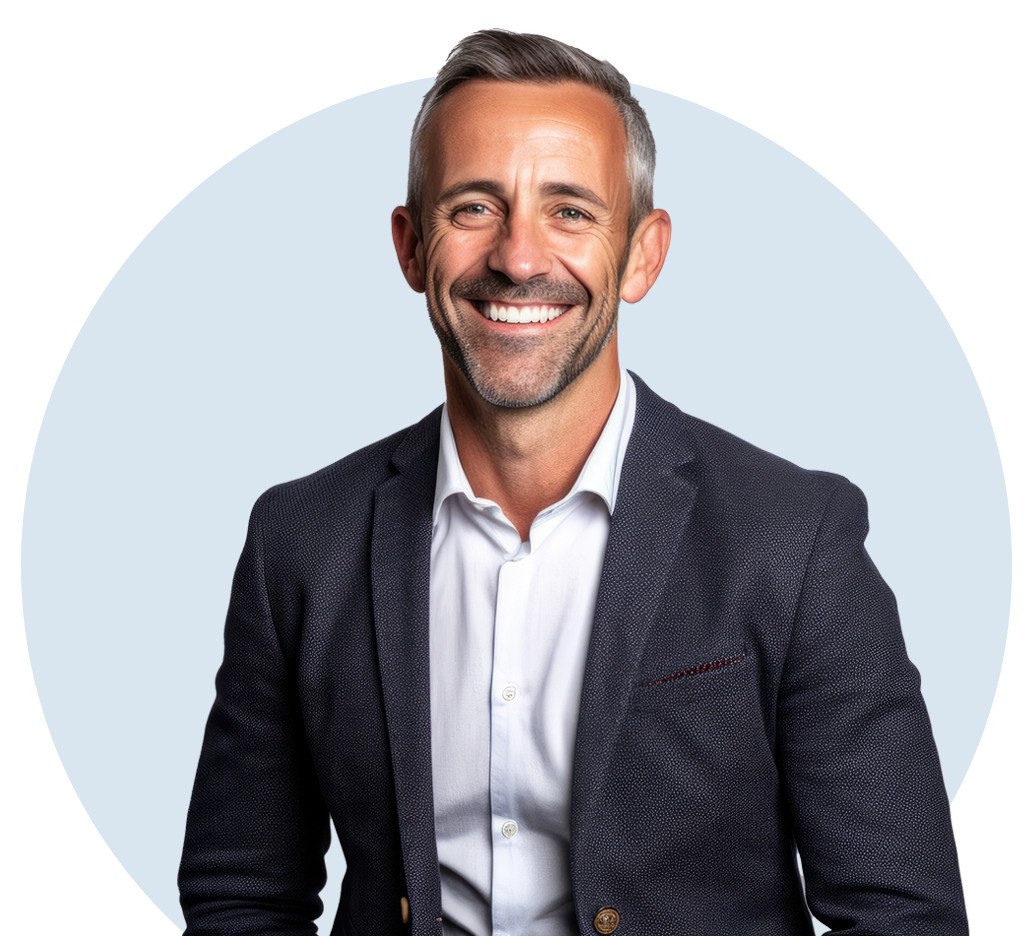 A smiling man with short gray hair stands confidently in a dark blazer and white shirt, set against a light blue circular backdrop that subtly resembles a default footer design.