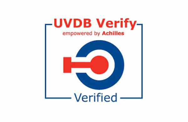 The image showcases the UVDB Verify logo, featuring the text "UVDB Verify empowered by Achilles" in red and a checked-off circular symbol in blue. Below the symbol, the word "Verified" appears in blue. Ideal for enhancing SEO on your Homepage with verified credentials.