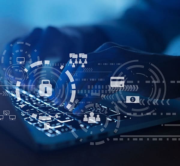 A person types on a laptop keyboard, with semi-transparent digital icons overlaying the image. Icons represent cybersecurity elements such as locks, payment cards, network connections, user profiles, and cloud storage, suggesting data protection and defense against cybersecurity threats.
