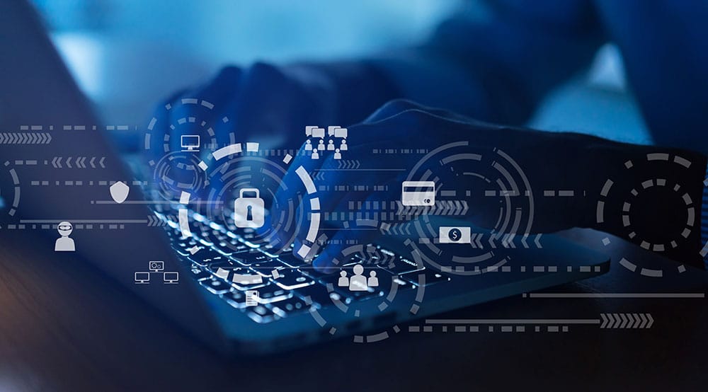 A person types on a laptop keyboard, with semi-transparent digital icons overlaying the image. Icons represent cybersecurity elements such as locks, payment cards, network connections, user profiles, and cloud storage, suggesting data protection and defense against cybersecurity threats.