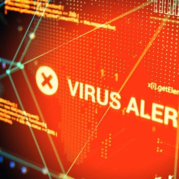 A graphical representation shows a red "VIRUS ALERT" warning with a white 'X' icon on a digital screen. Technological patterns and lines in blue and yellow tones are visible in the background, emphasizing the concept of cybersecurity threats and various types of Cyber Attacks.