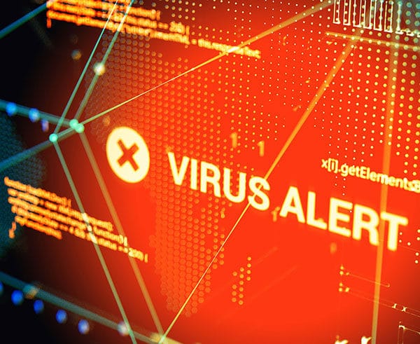 A graphical representation shows a red "VIRUS ALERT" warning with a white 'X' icon on a digital screen. Technological patterns and lines in blue and yellow tones are visible in the background, emphasizing the concept of cybersecurity threats and various types of Cyber Attacks.