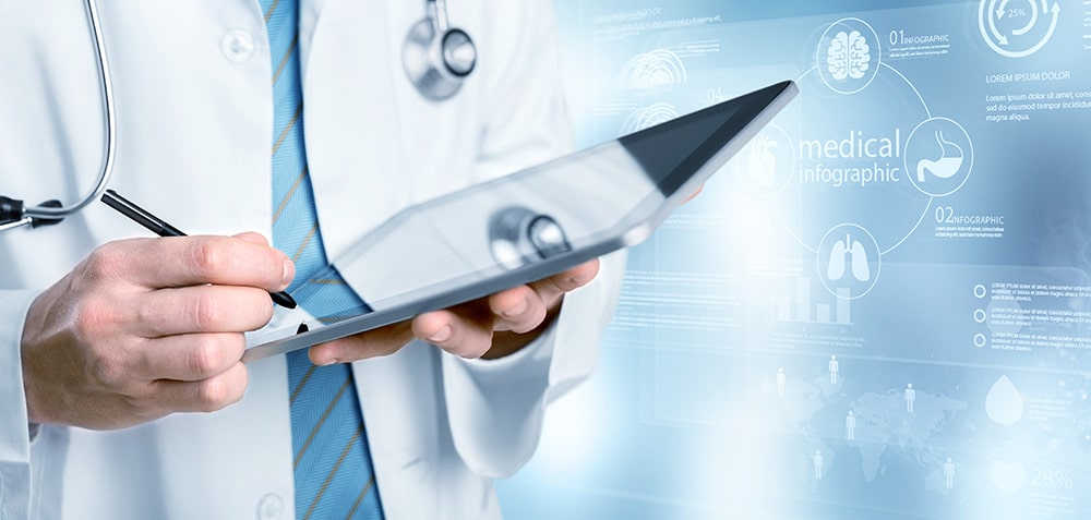 A doctor wearing a white coat and blue tie uses a stylus to interact with a tablet. The background features transparent medical infographics including charts, graphs, and icons related to healthcare and medical devices, creating a futuristic and technology-driven atmosphere.