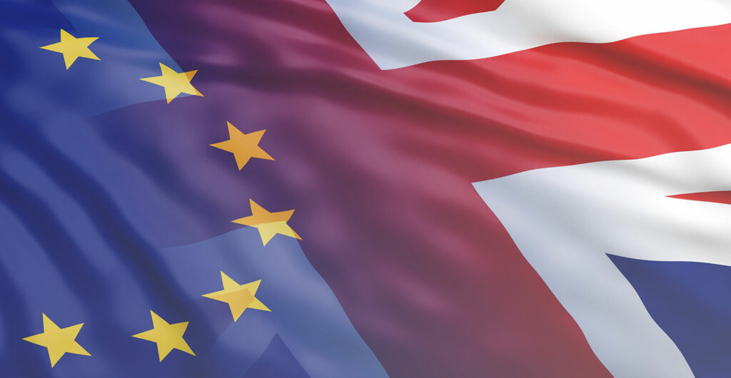 Image showing overlapping flags of the European Union and the United Kingdom. The EU flag features a circle of 12 golden stars on a blue background, while the UK flag, known as the Union Jack, incorporates red, white, and blue elements. This visual reflects the intricate relationship between Europe and the UK.